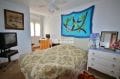 real estate costa brava: apartment 97 m², first bedroom with double bed