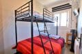 agence immobilière costa brava: villa 75 m², deuxième chambre avec lits superposés