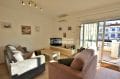 acheter appartement empuriabrava: salon avec terrasse vue sur canal 15 m²